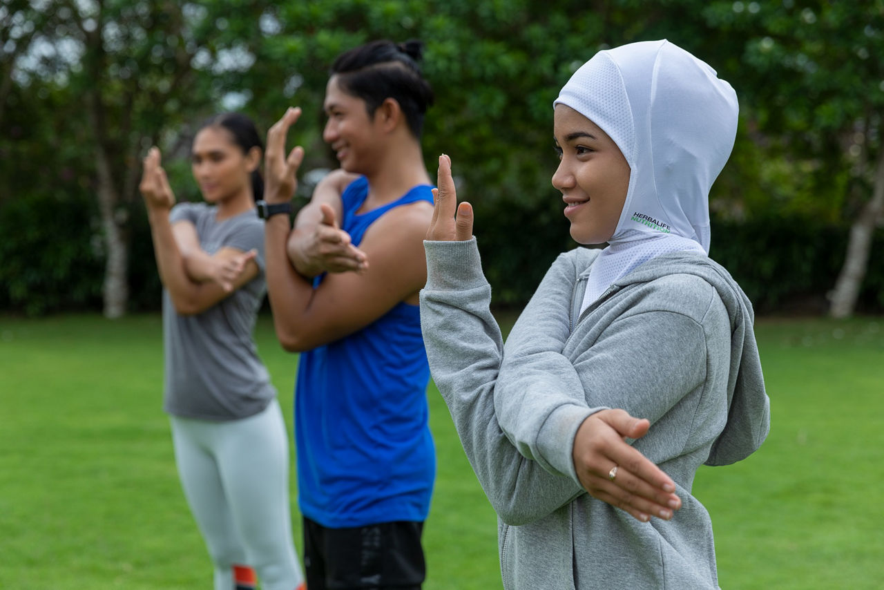 Friends stretching outdoors